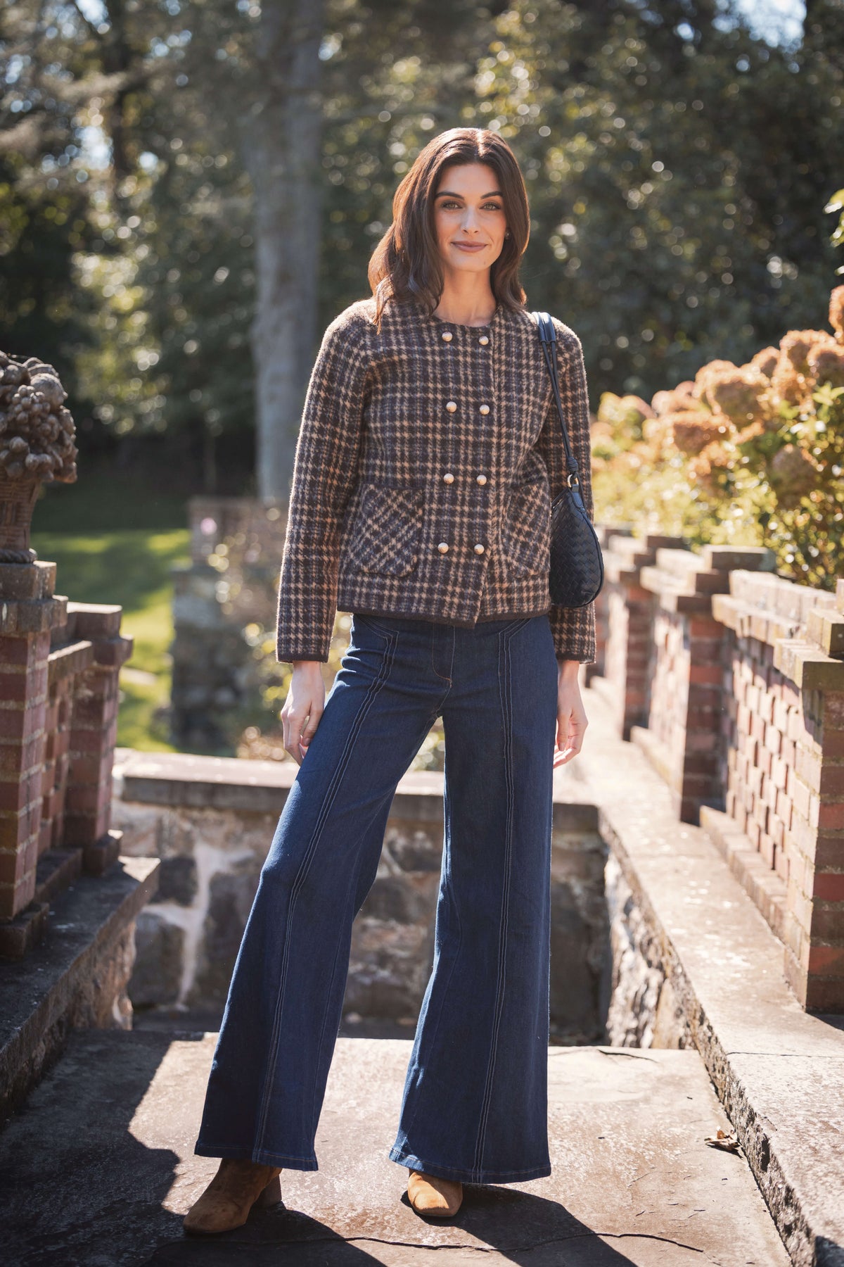 Brown and navy houndstooth tweed jacket with double-breasted button front and patch pockets.