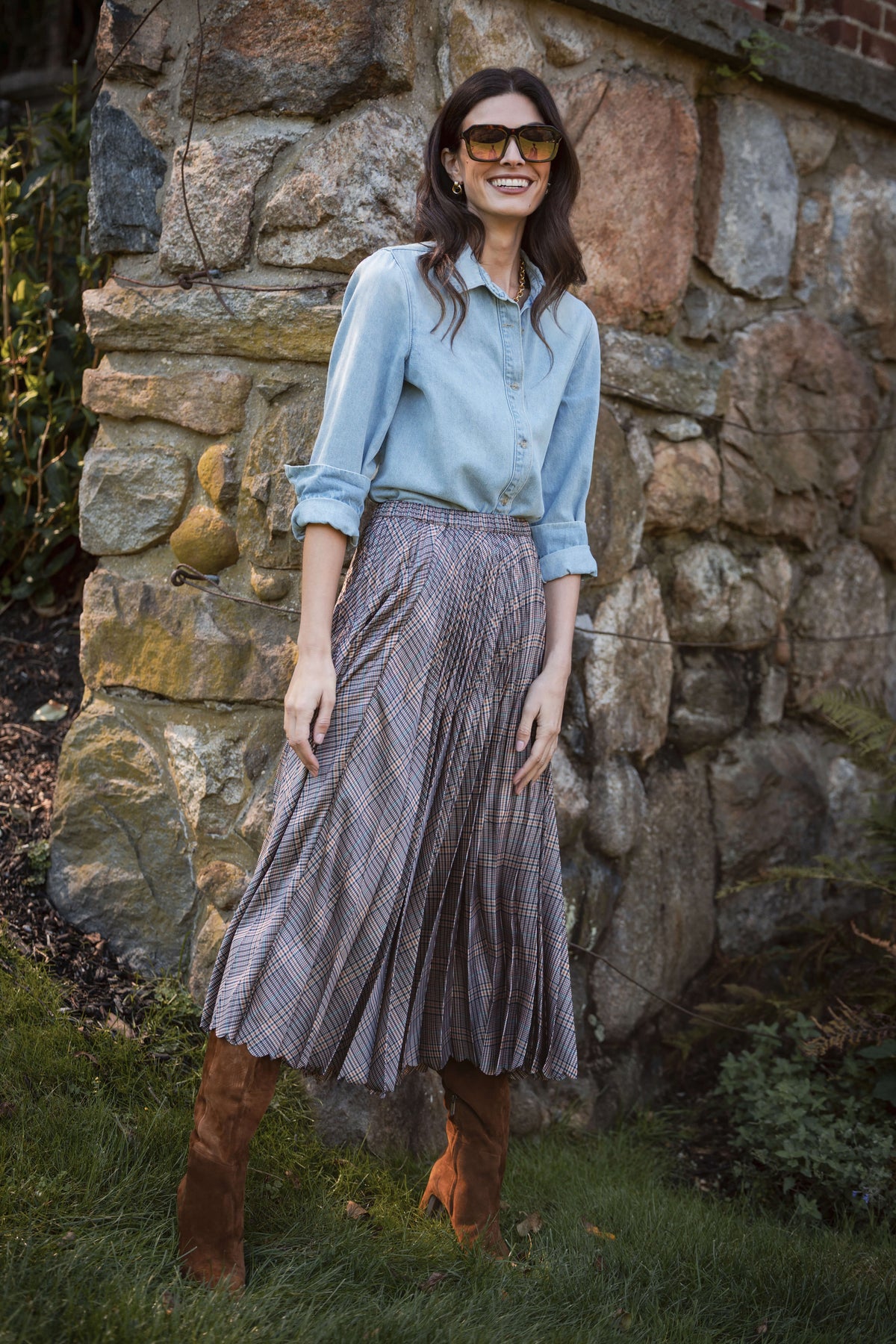 Plaid pleated maxi skirt in purple and gray tones with full-length silhouette.