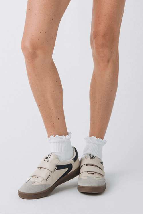 White crew socks with ruffled cuff and ribbed knit