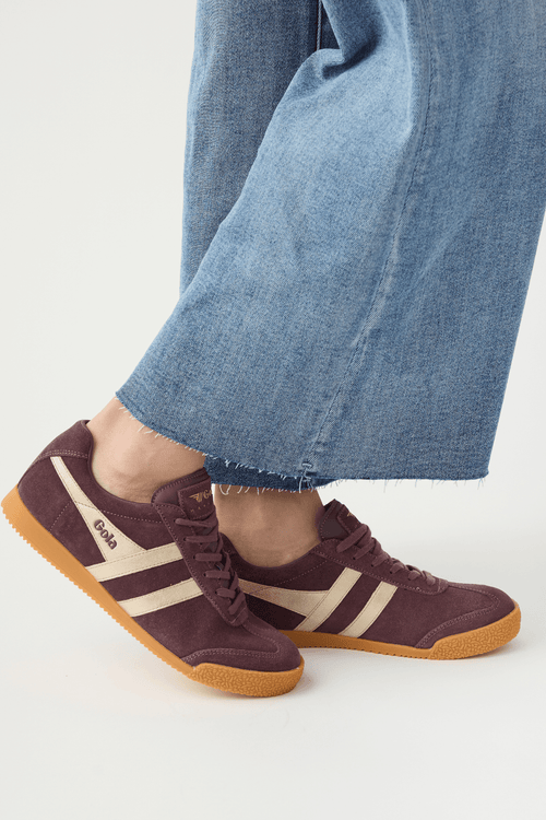 Cocoa brown suede lace-up sneakers with white side stripes and gum rubber sole