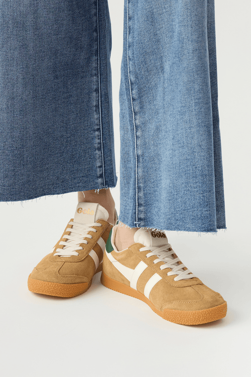 Elan sneakers front side view, tan suede with off-white stripes, green heel details, gum sole.