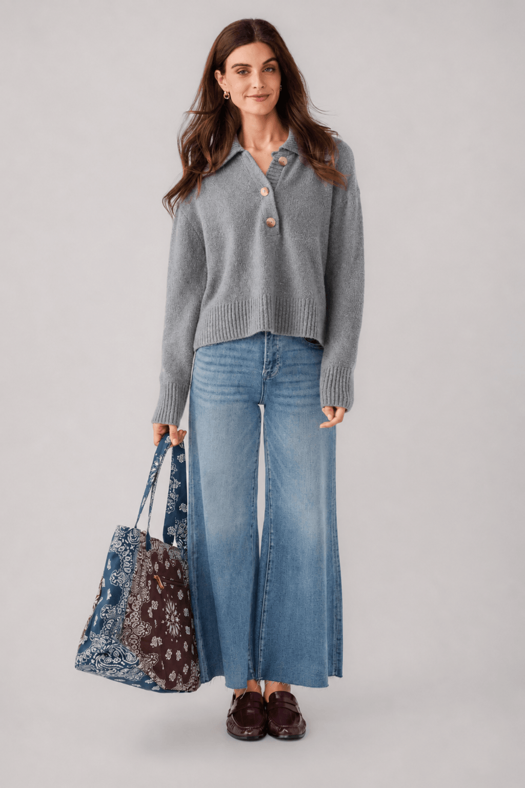Grey knit polo sweater with button placket and turn-down collar, long sleeves, ribbed hem