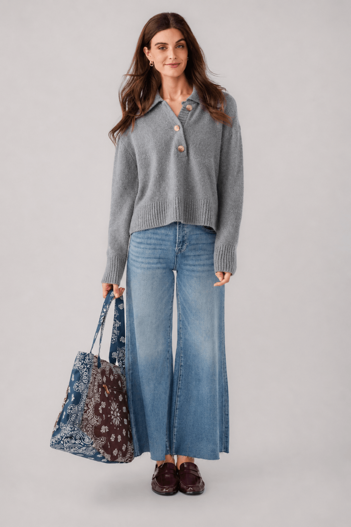 Grey knit polo sweater with button placket and turn-down collar, long sleeves, ribbed hem