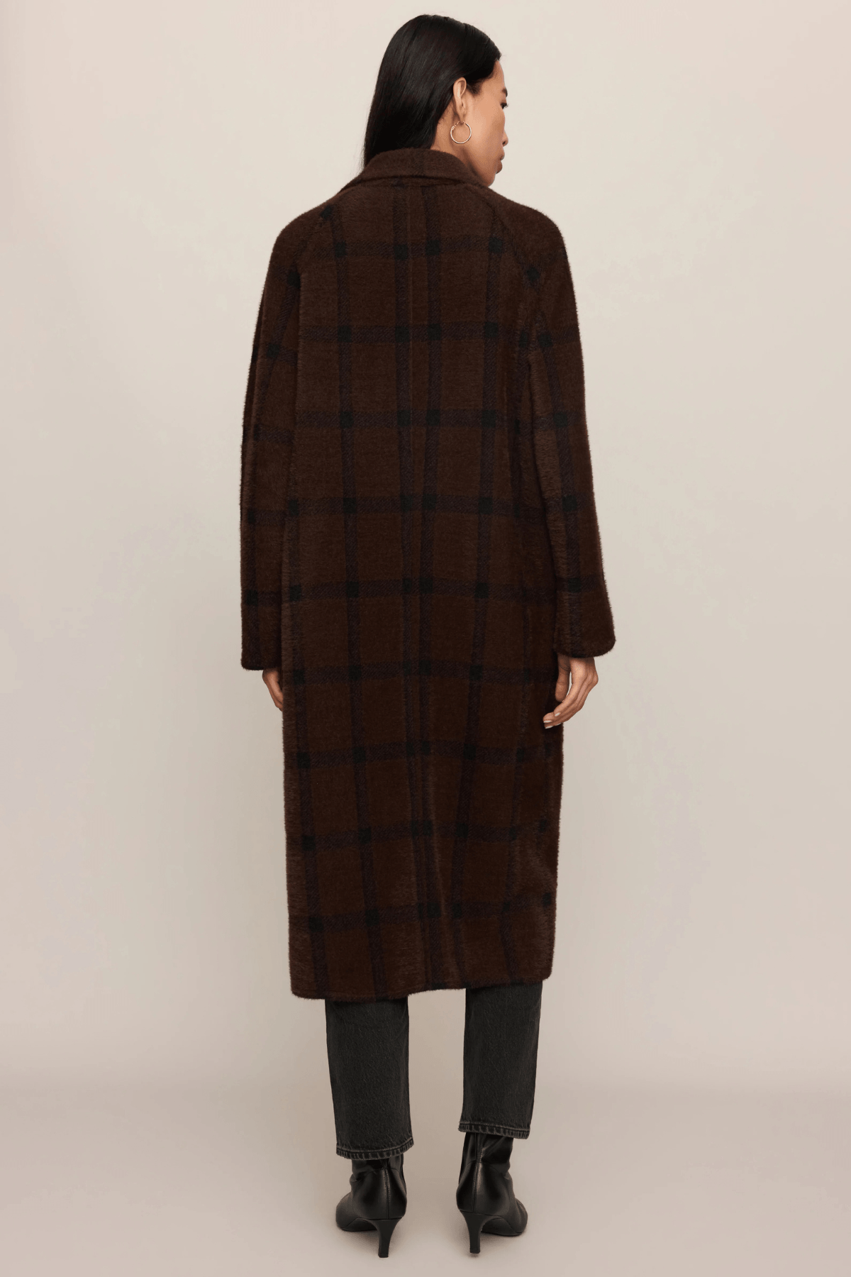 Brown plaid cocoon coat with collar, shown from back on model wearing jeans and black boots.