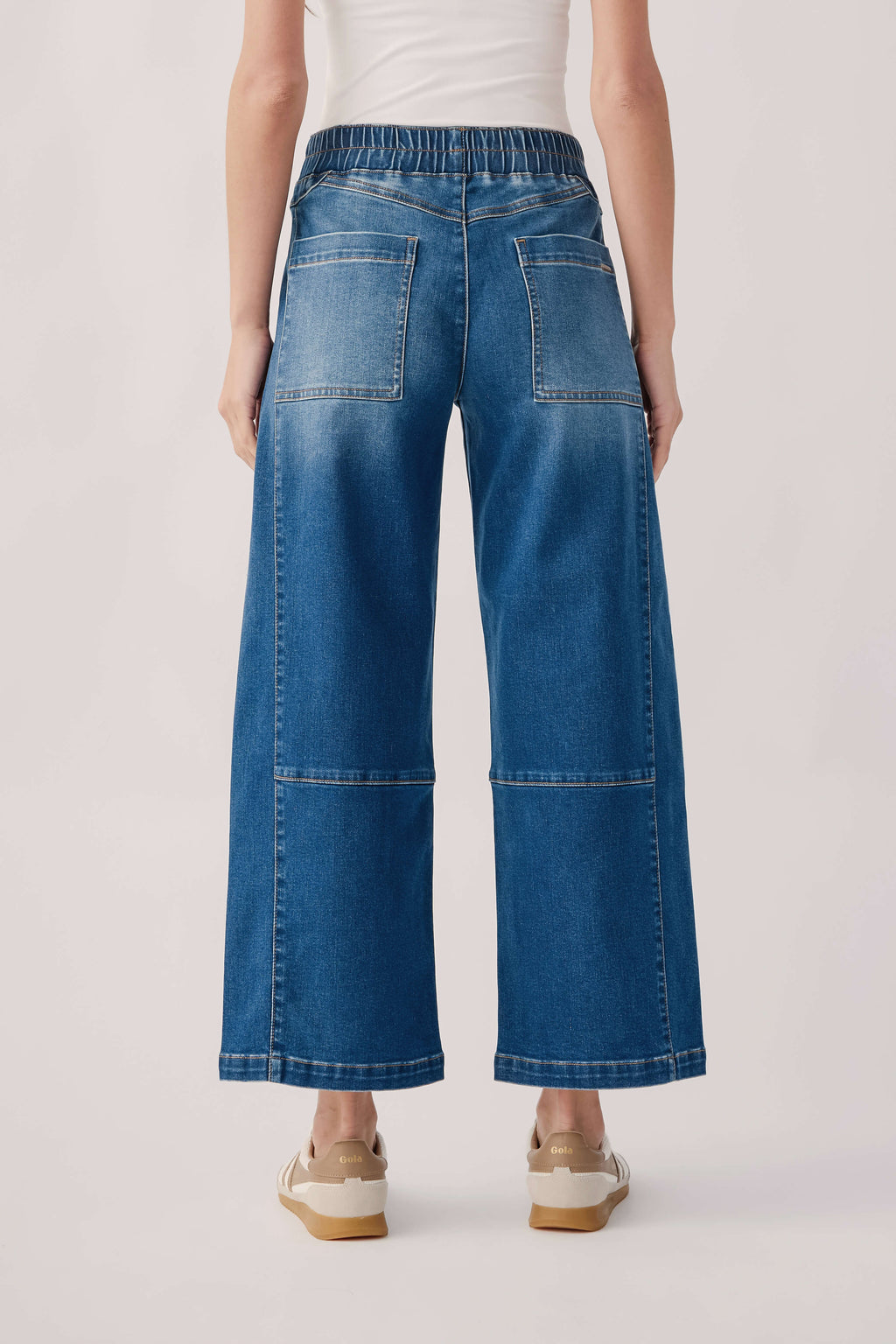 Blue denim pull-on barrel jeans with back patch pockets and wide straight legs