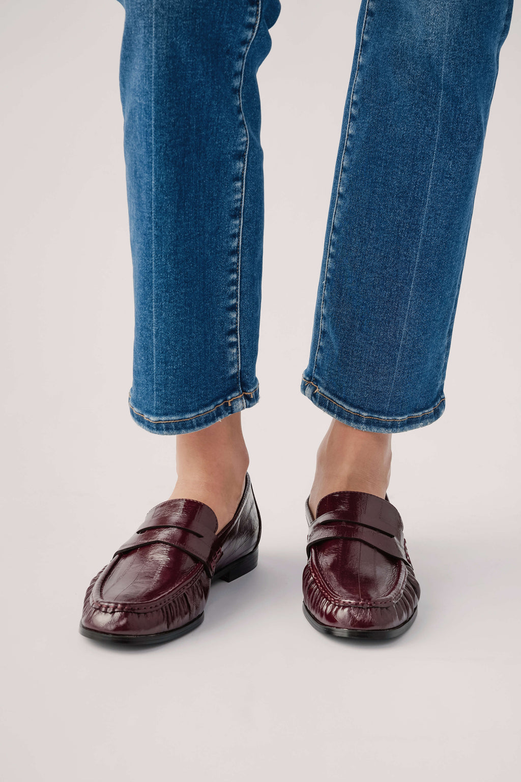 Wine leather loafer with moc toe stitching and slip-on design