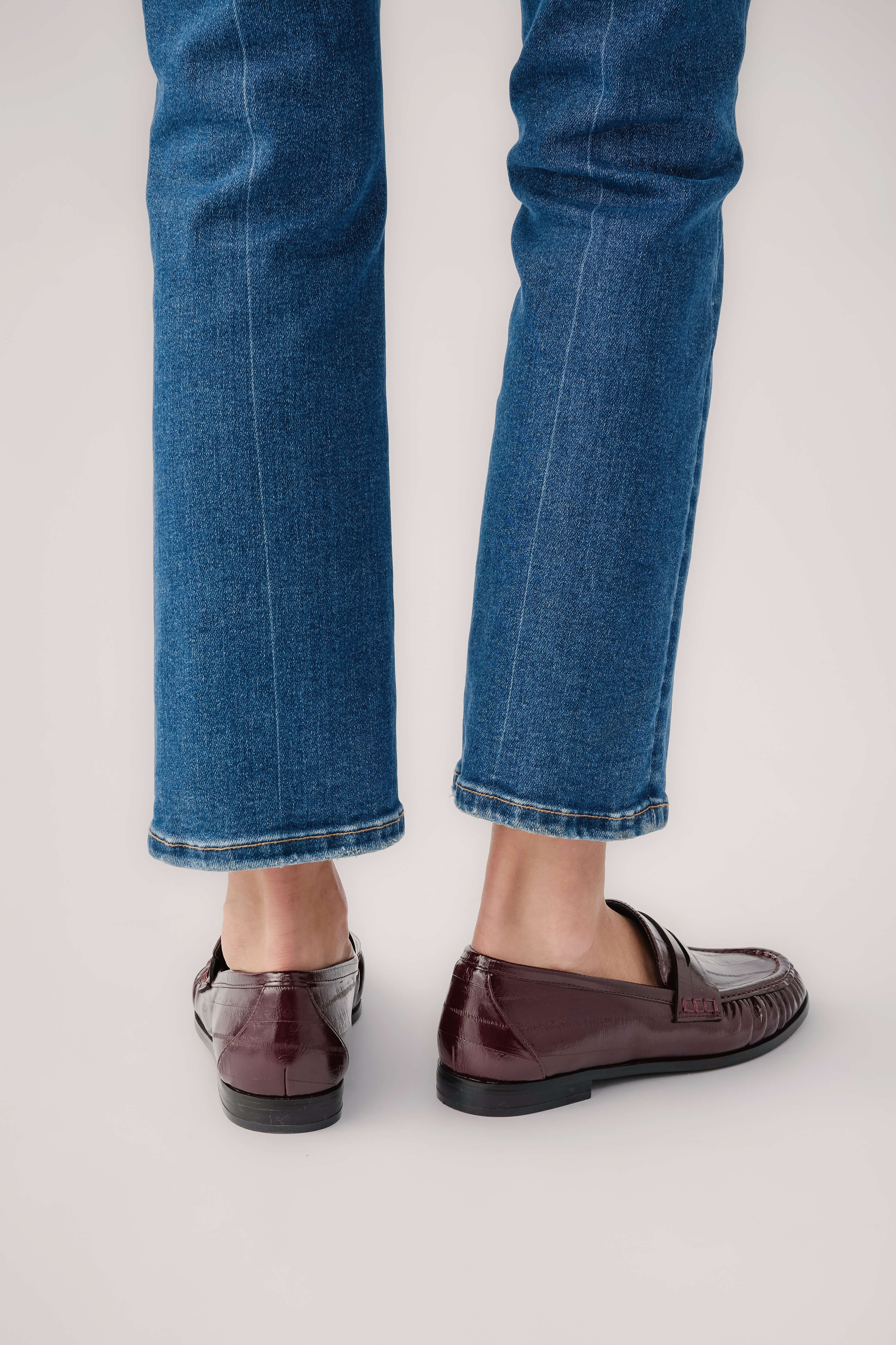Wine leather loafer with moc toe stitching, side and back view