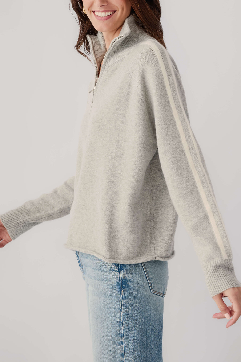 Heather grey 1/2-zip knit sweater with cream stripe detail along sleeve and hem
