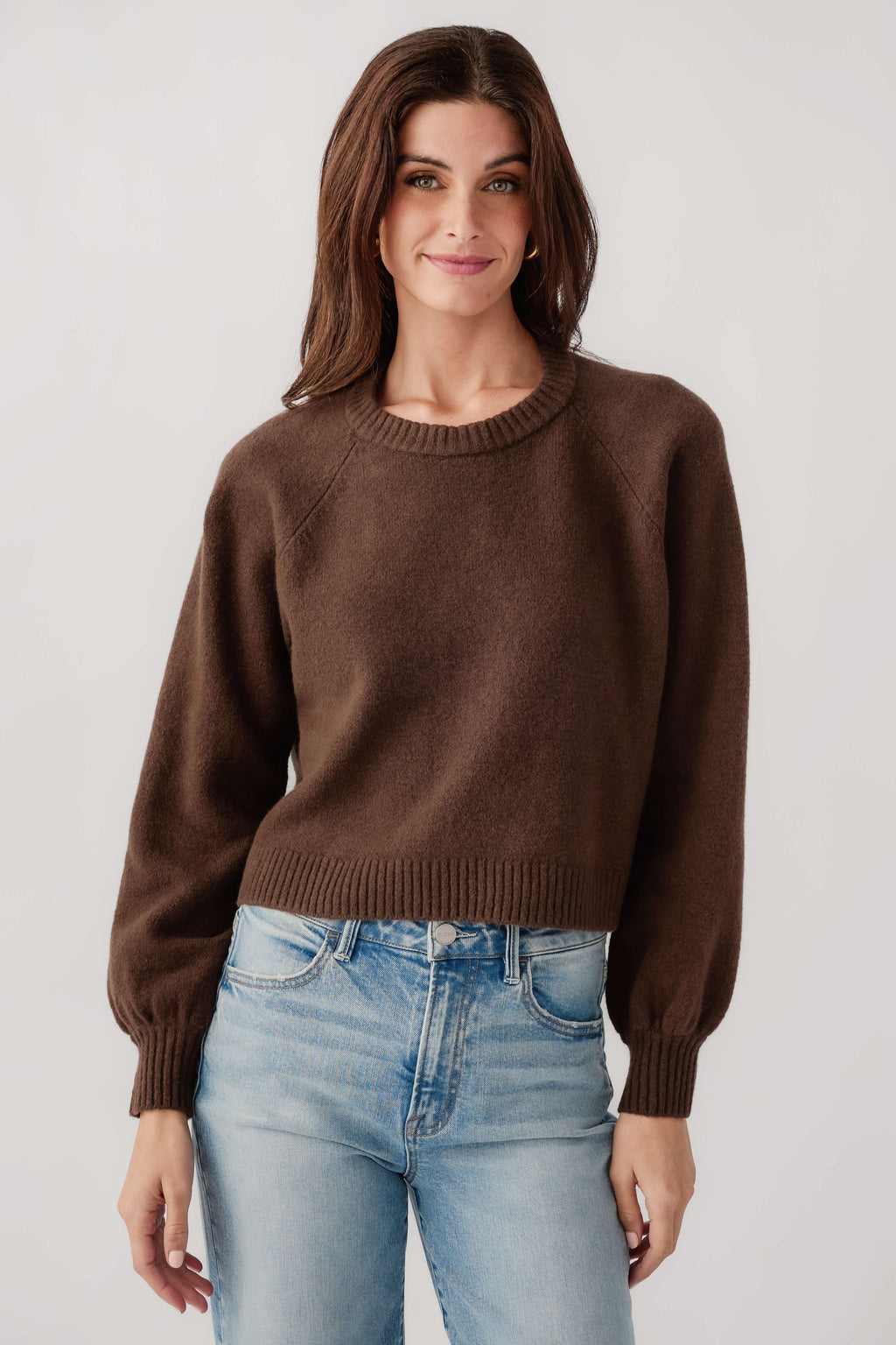 Dark brown crewneck knit sweater with ribbed cuffs and hem