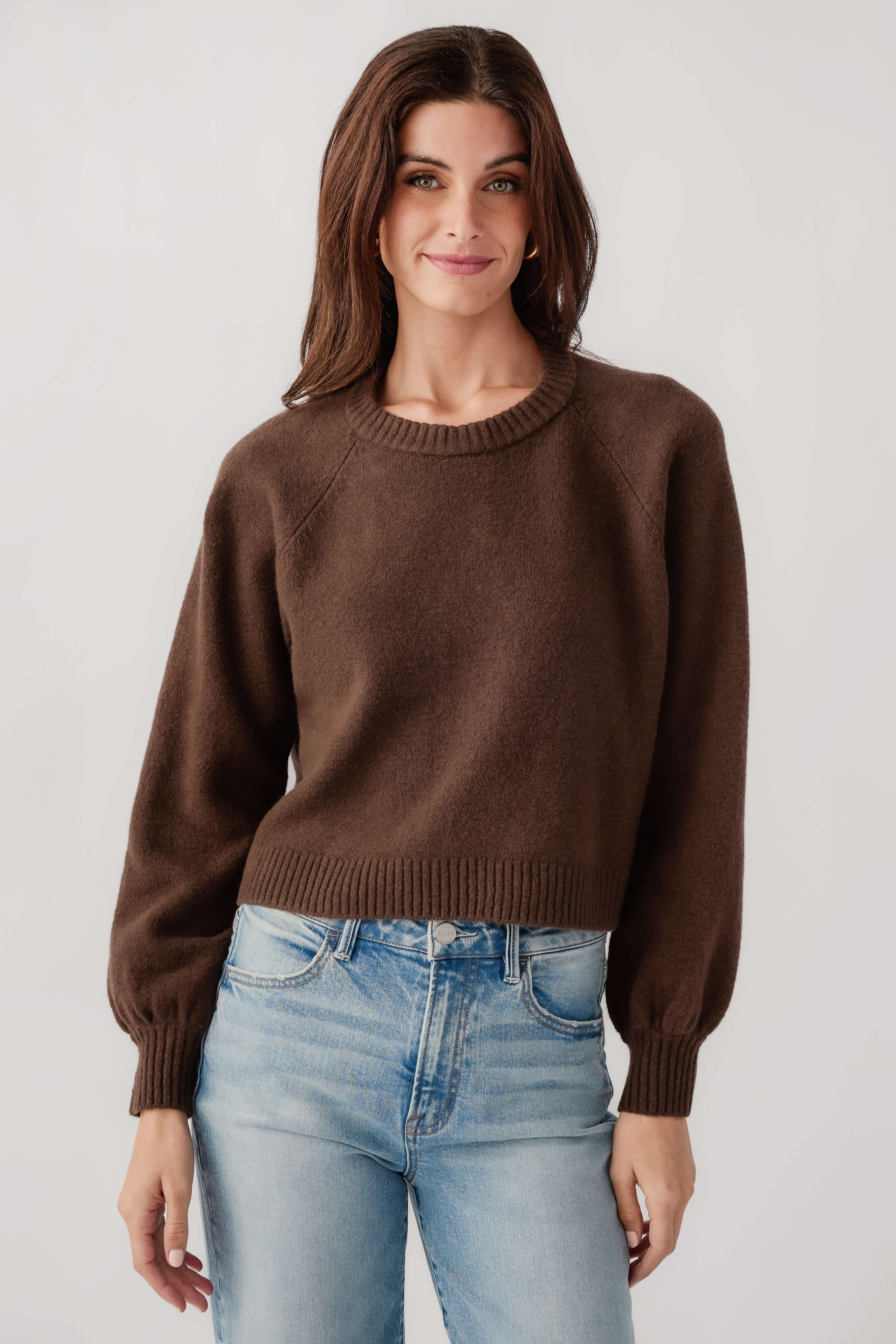 Dark brown crewneck knit sweater with ribbed cuffs and hem