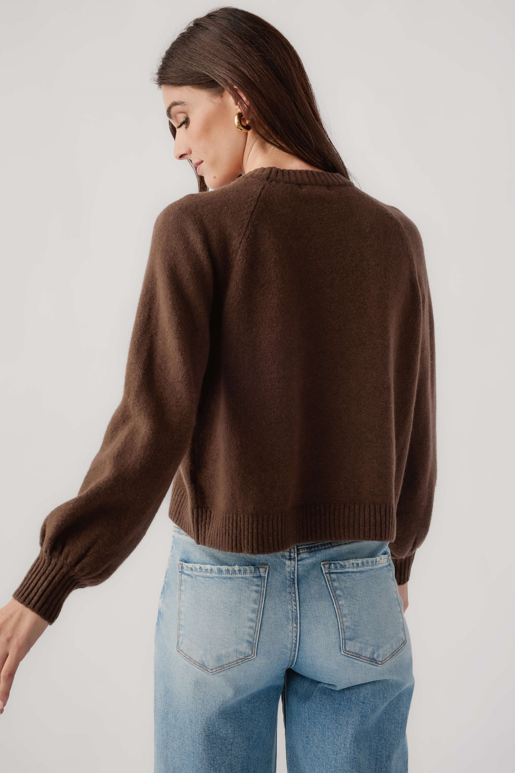 Dark brown crewneck knit sweater, back view with ribbed hem and cuffs