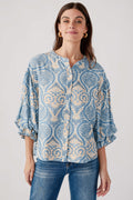 Blue damask print balloon-sleeve button-up top with round neckline, front view