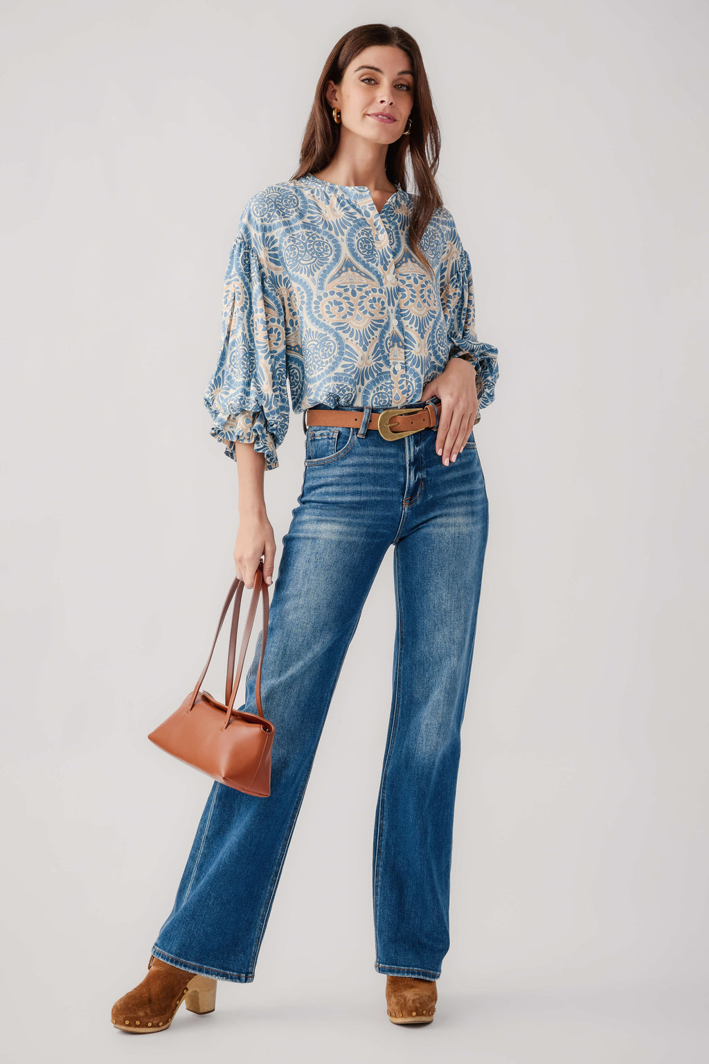 Blue damask print balloon-sleeve button-up top, worn with blue jeans, full view