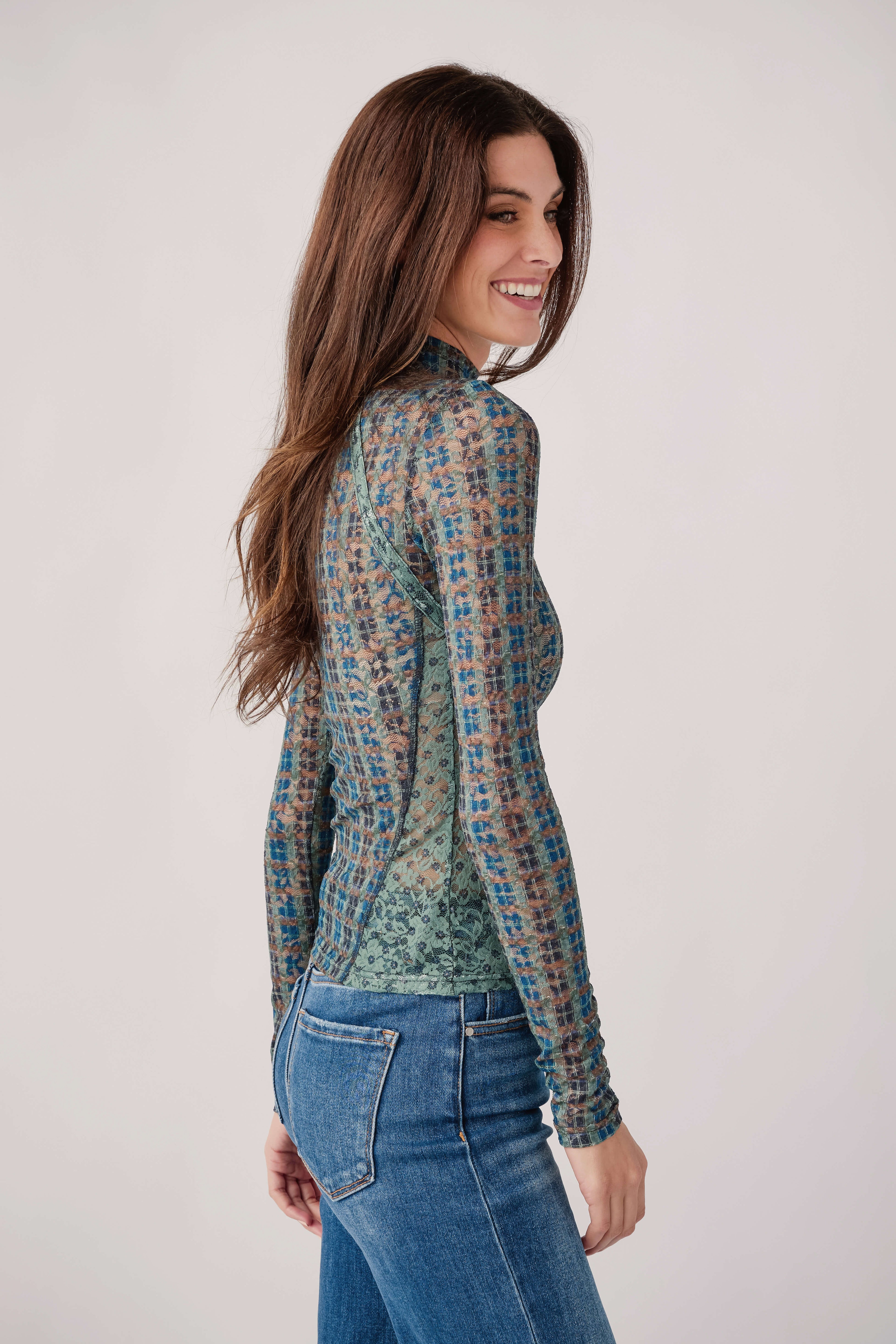 Sheer lace long-sleeve turtleneck top, side view, teal patterned