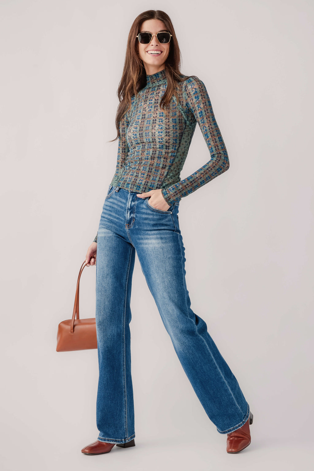 Sheer lace long-sleeve turtleneck top with teal geometric pattern