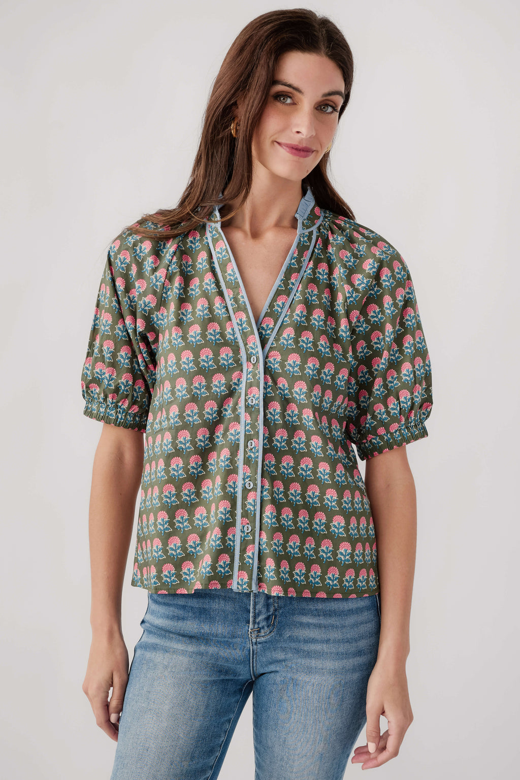 Green block-print peasant top with V-neck, short puff sleeves, button placket