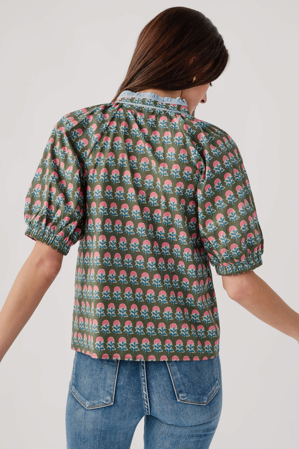 Back of green block-print top with puff sleeves and gathered yoke