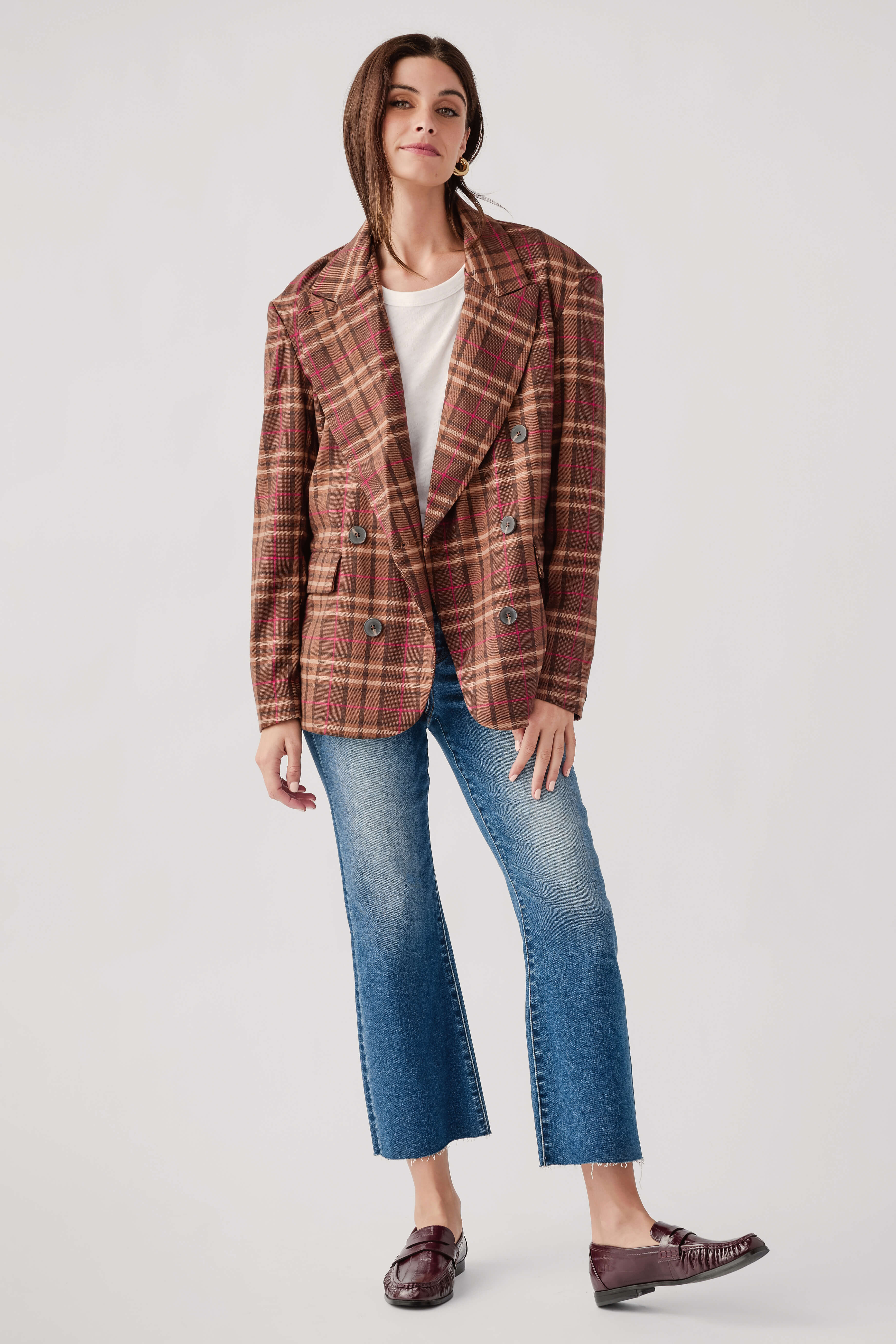Brown plaid double-breasted blazer with notched lapels, buttoned cuffs, and long sleeves