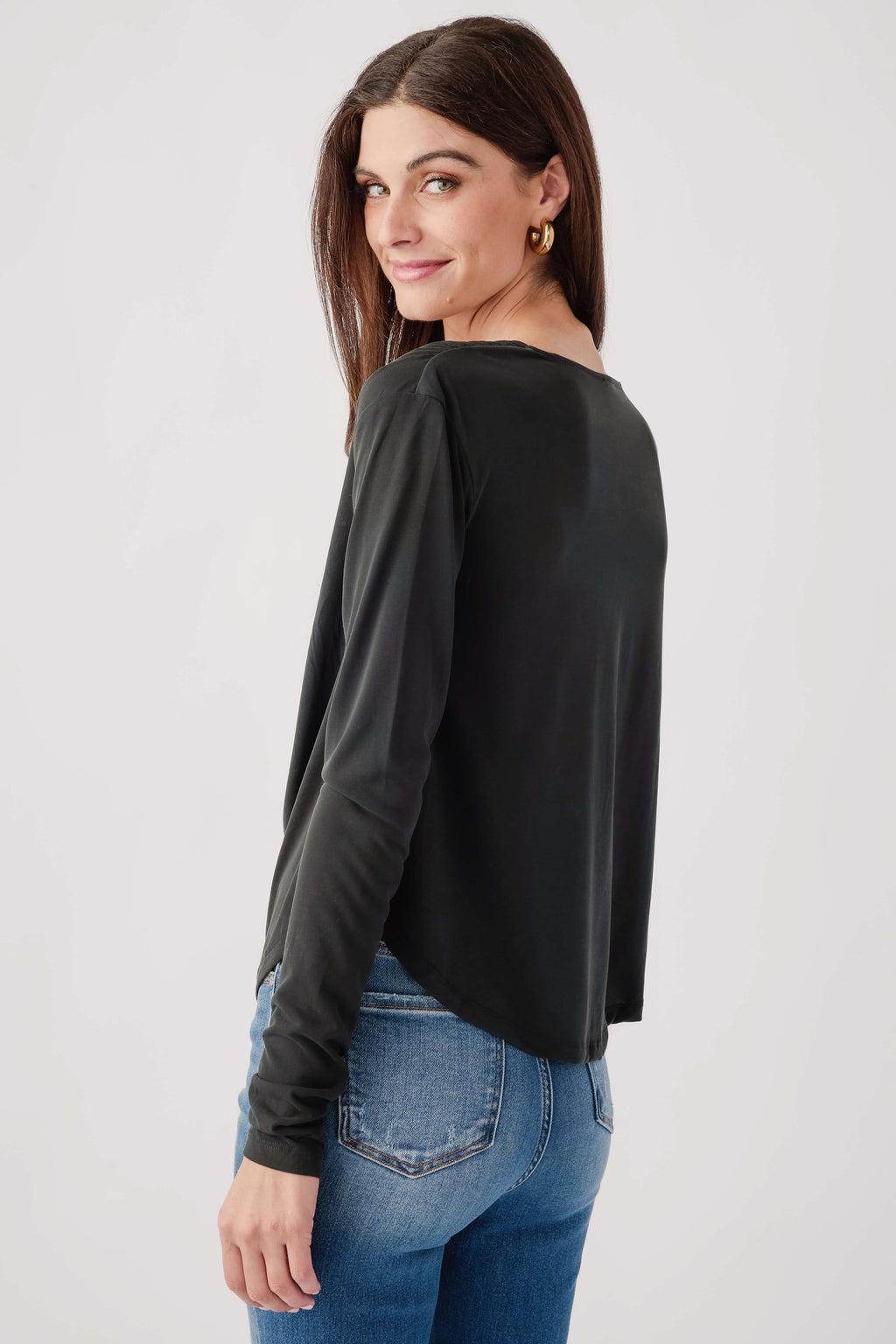 Black long-sleeve draped top with smooth back and side seams