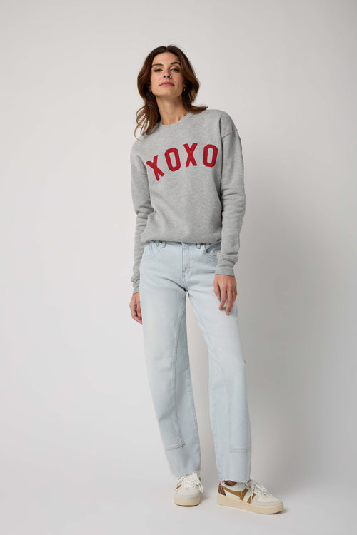 Heather gray XOXO sweatshirt with red XOXO lettering on chest, crewneck, long sleeves