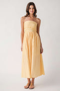 Yellow strapless midi dress with smocked bodice and pleated striped skirt
