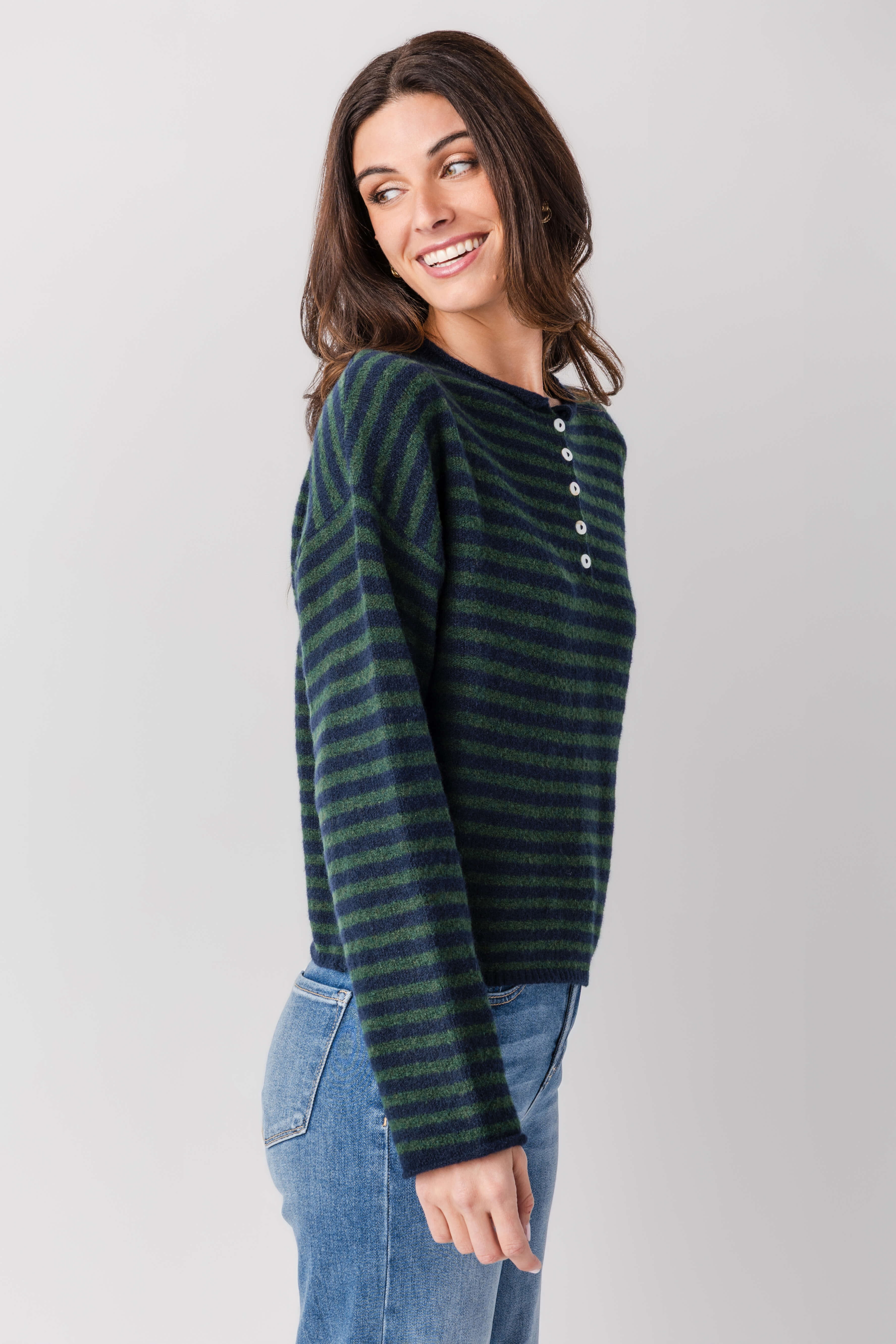 Striped henley pullover, dark green and black stripes, long sleeves and curved hem