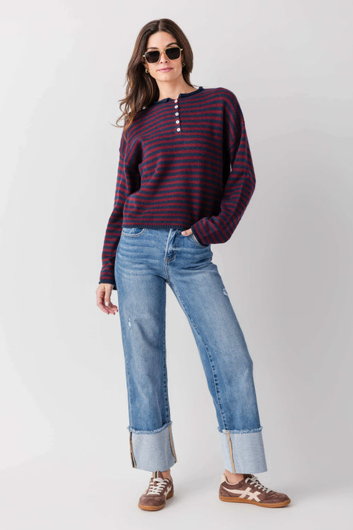 Medium-wash cuffed jeans with relaxed straight legs and stitched seams