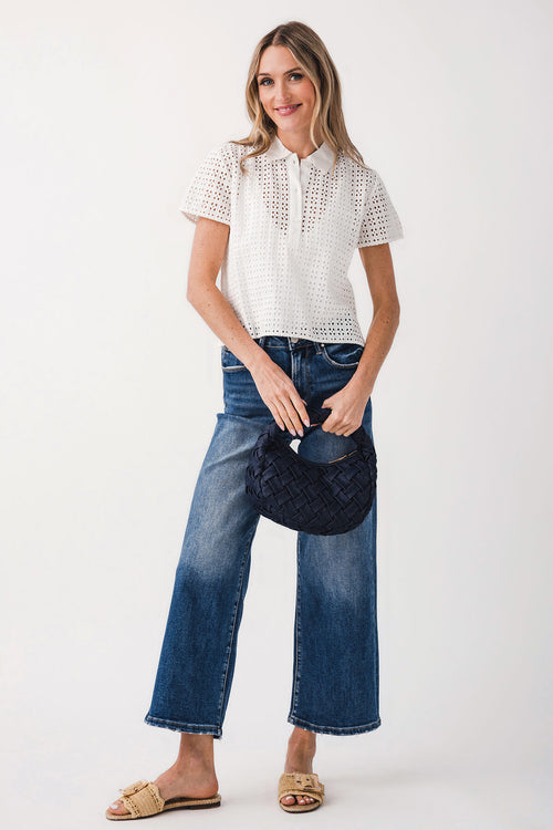 Cropped open-knit short-sleeve top with V-neck, worn with blue jeans