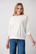 White solid 3/4 dolman sleeve sweatshirt top with crew neck and relaxed fit.