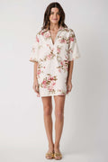 Women’s natural pink floral shift dress, V-neckline and short sleeves, straight silhouette