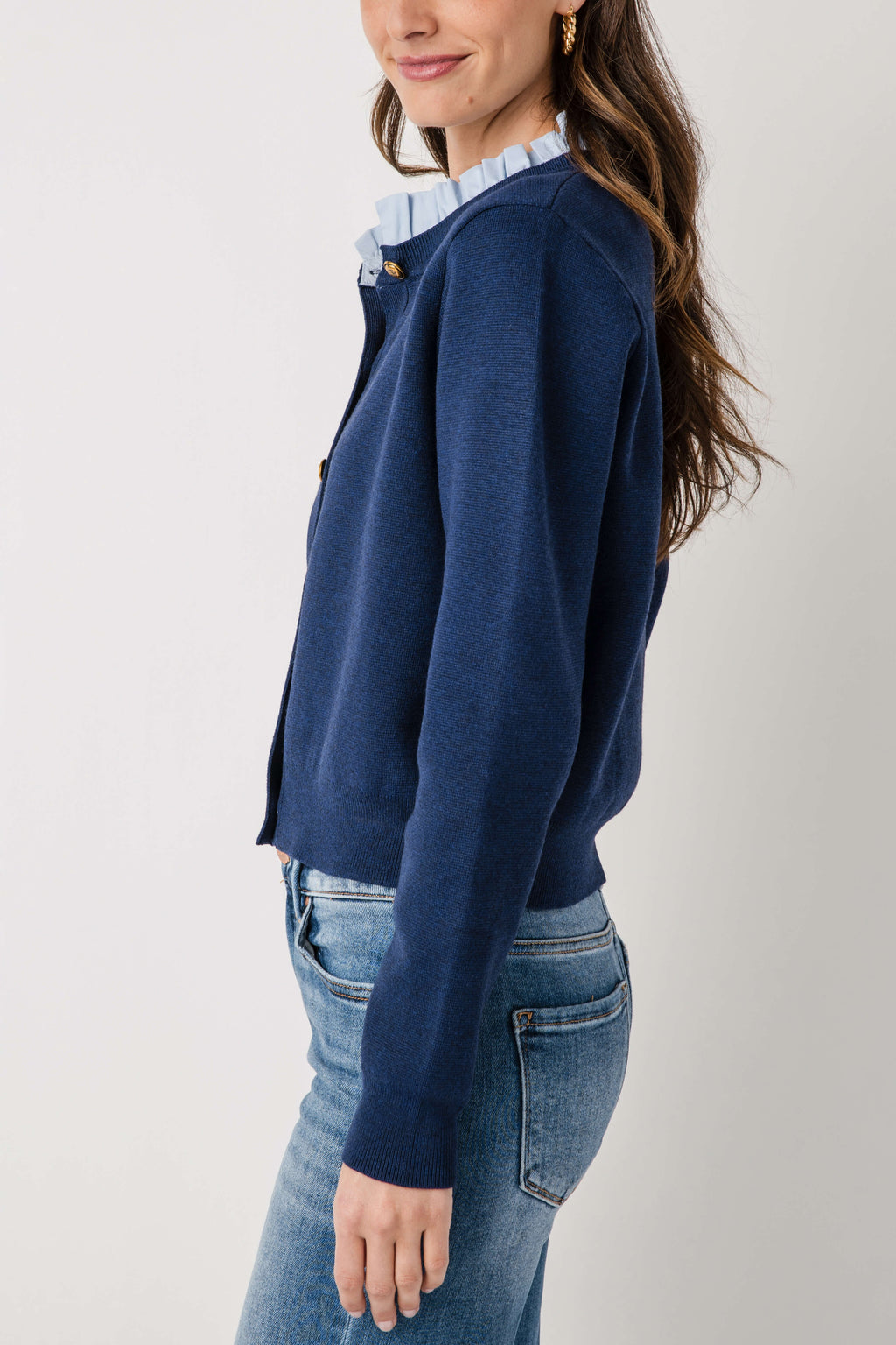 Navy ruffle-collar cardigan with button-front, long sleeves, shoulder tab detail