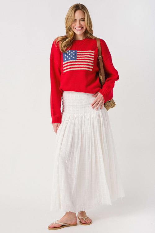 Ivory smocked waistband maxi skirt with tiered, airy fabric