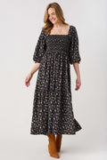 Black floral midi dress with square neckline and 3/4 sleeves, elastic waist detail