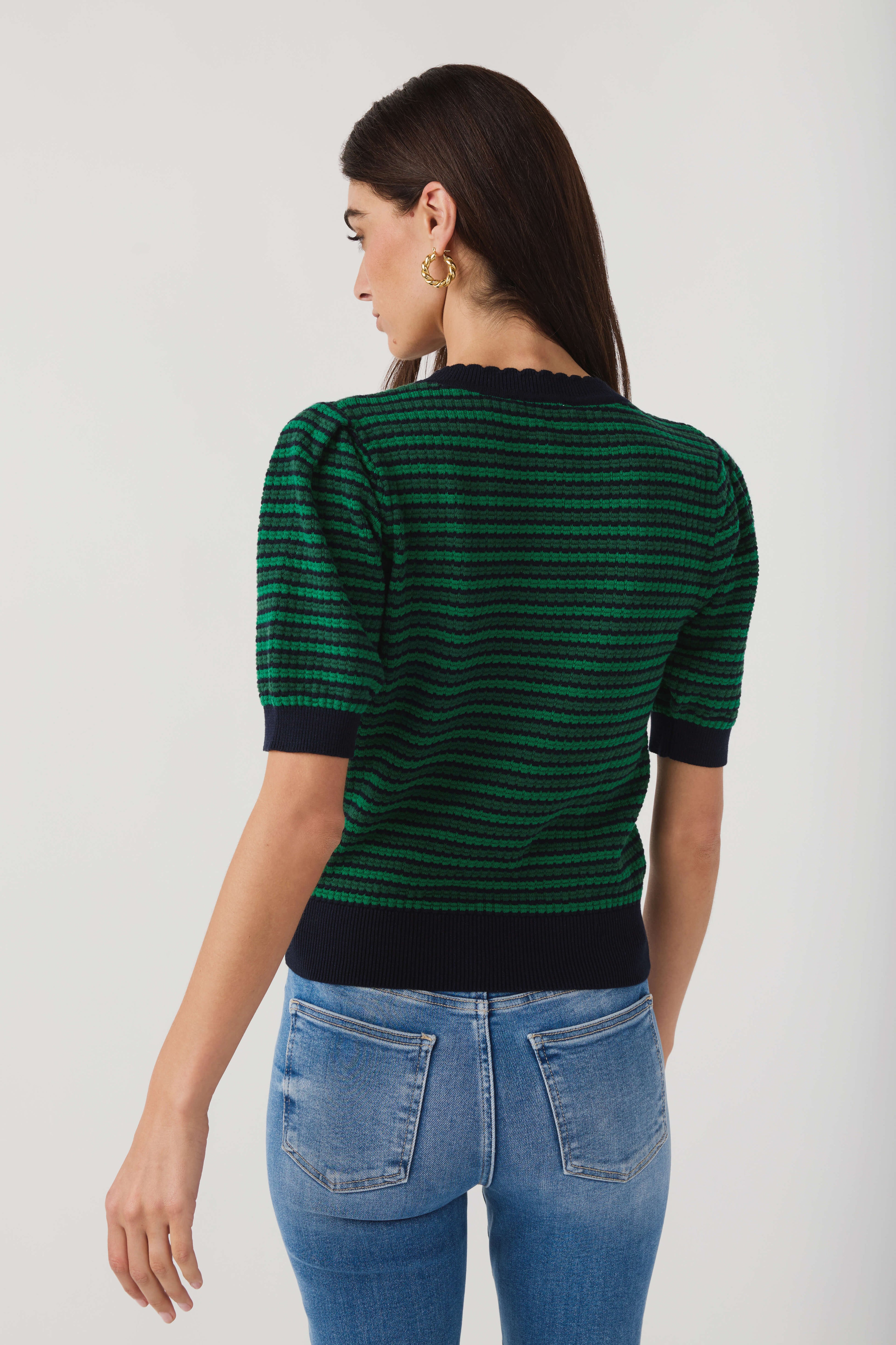 Back view of green and navy striped crochet top with short sleeves