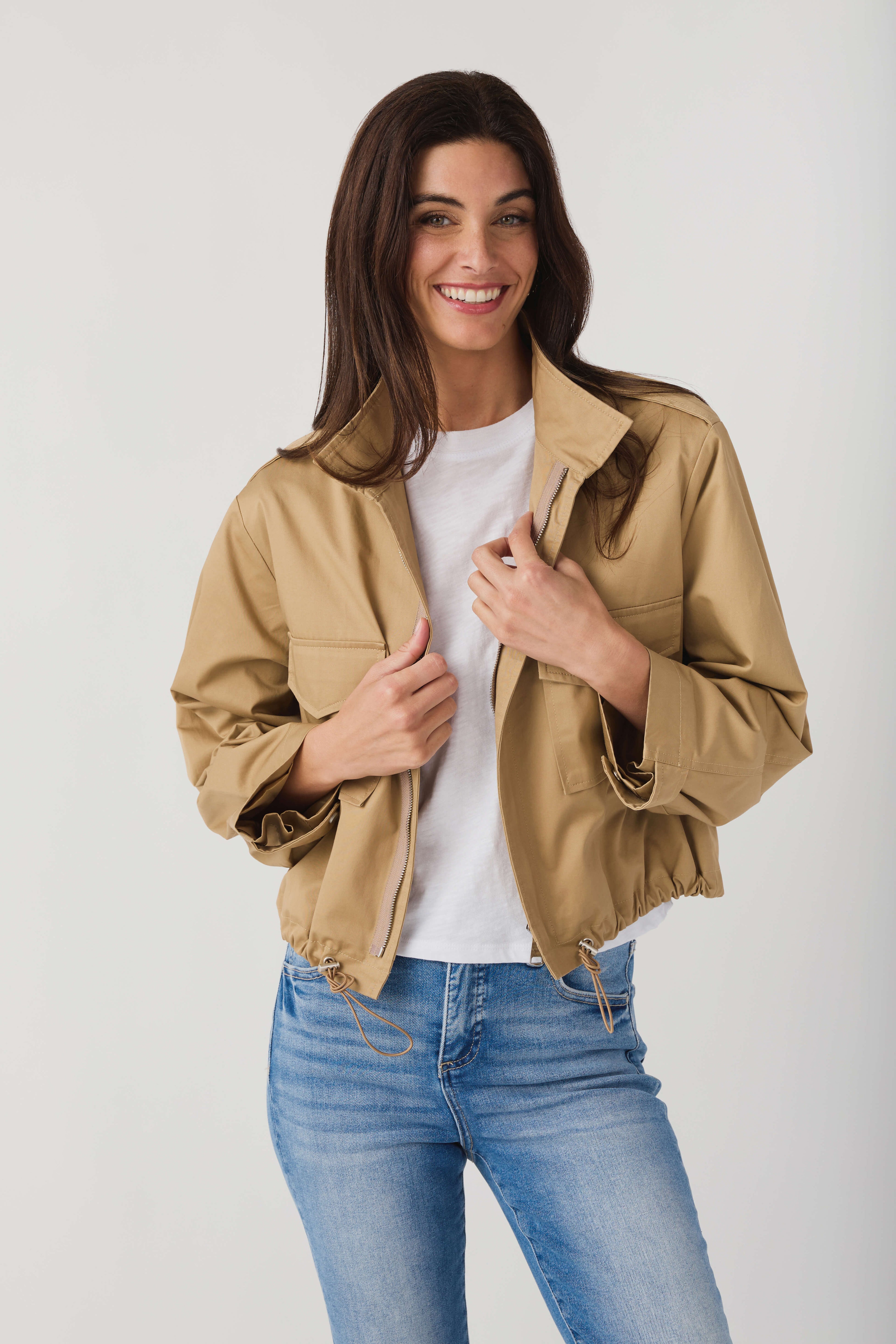Khaki beige utility short jacket with snap-front closure and flap pockets