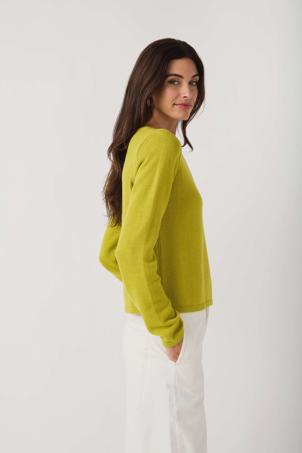 Lime knit crewneck sweater with long sleeves, side view