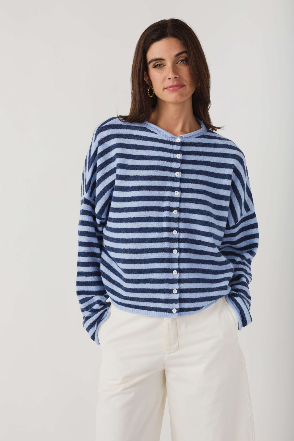 Blue and white striped knit cardigan with button placket and long sleeves