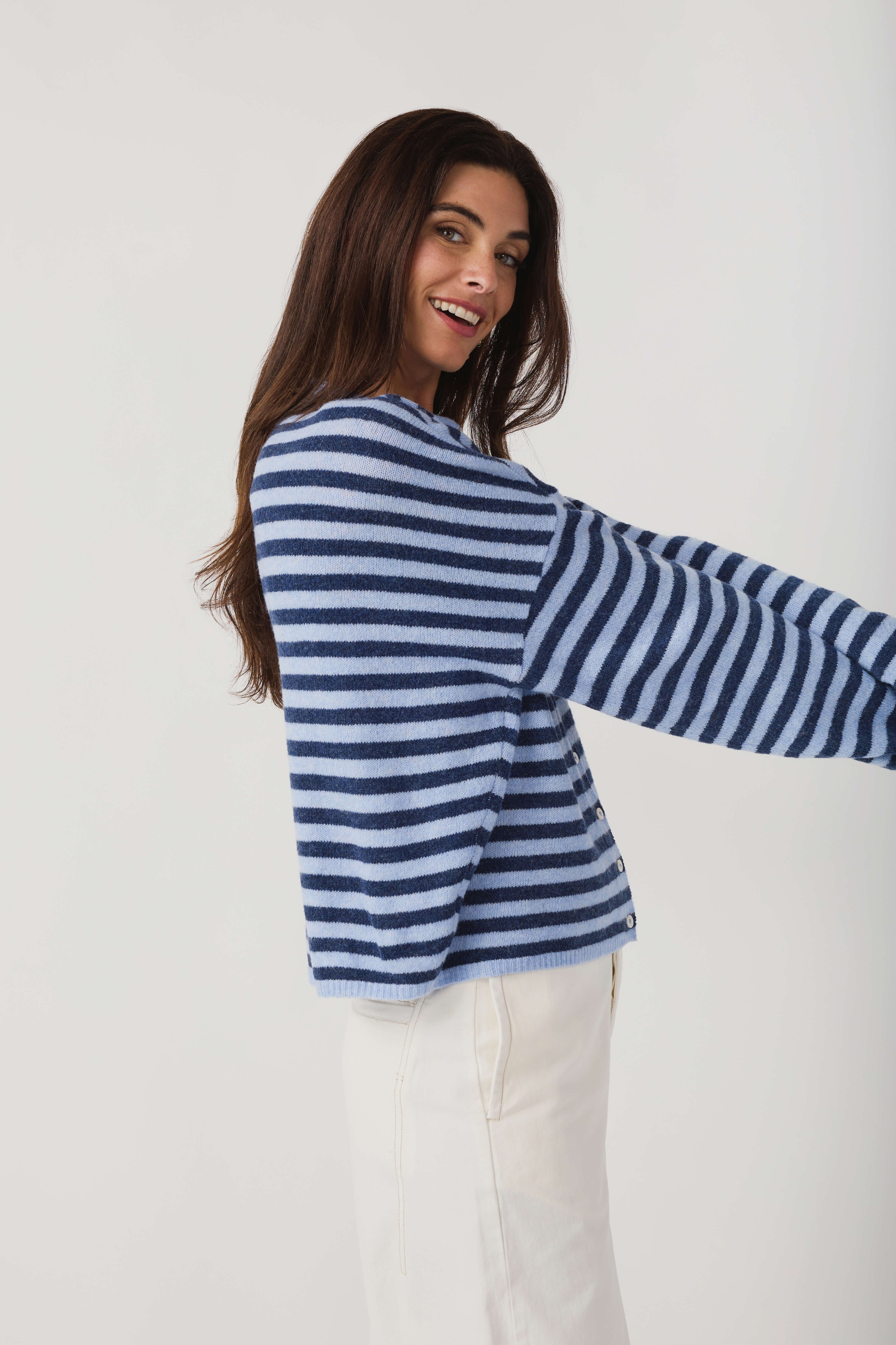 Striped knit cardigan with button front, long sleeves, crew neck; side view