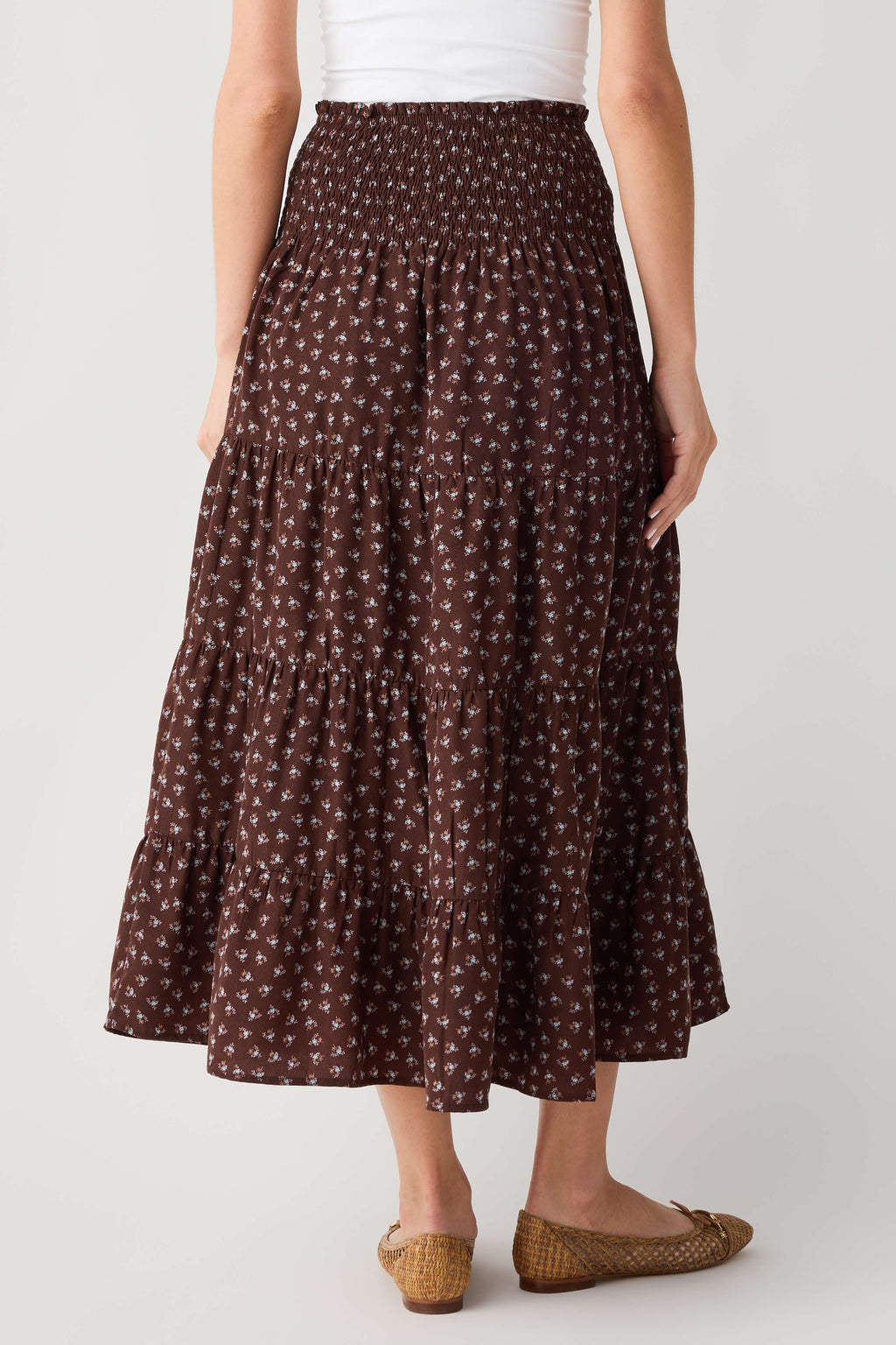 Smocked waist espresso-brown floral midi skirt with gathered, flared skirt hem