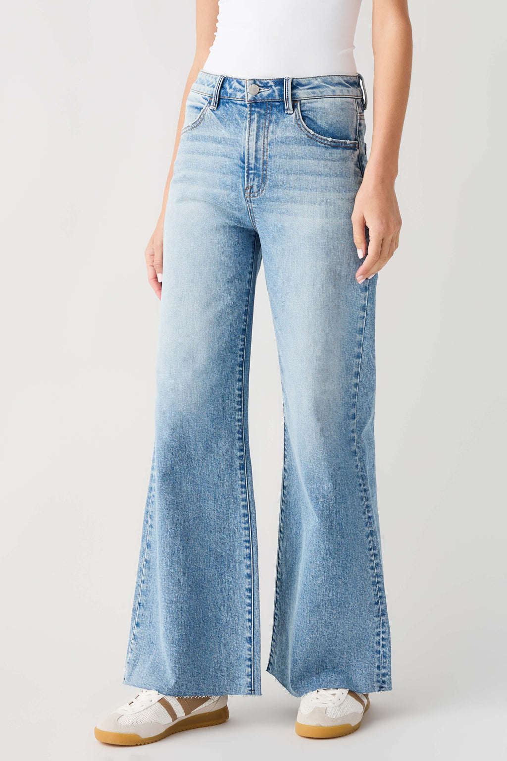 Light blue high-rise wide-leg jeans with belt loops and back patch pockets