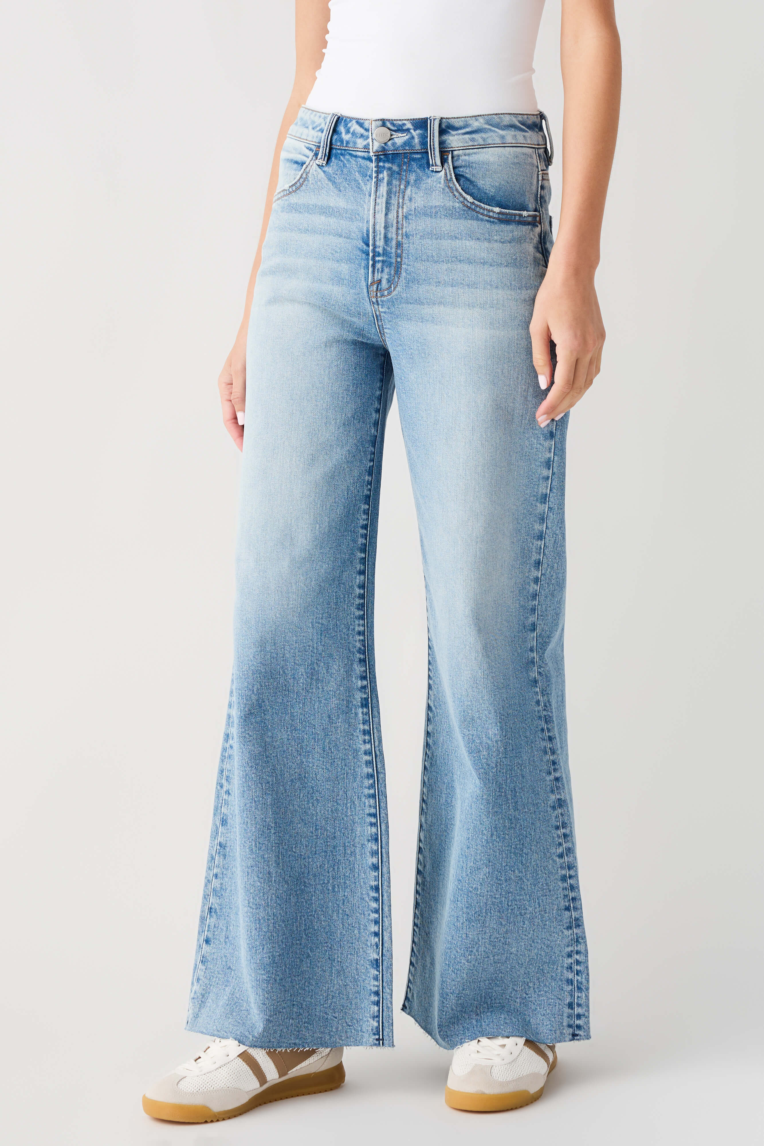 Light blue high-rise wide-leg jeans with belt loops and back patch pockets