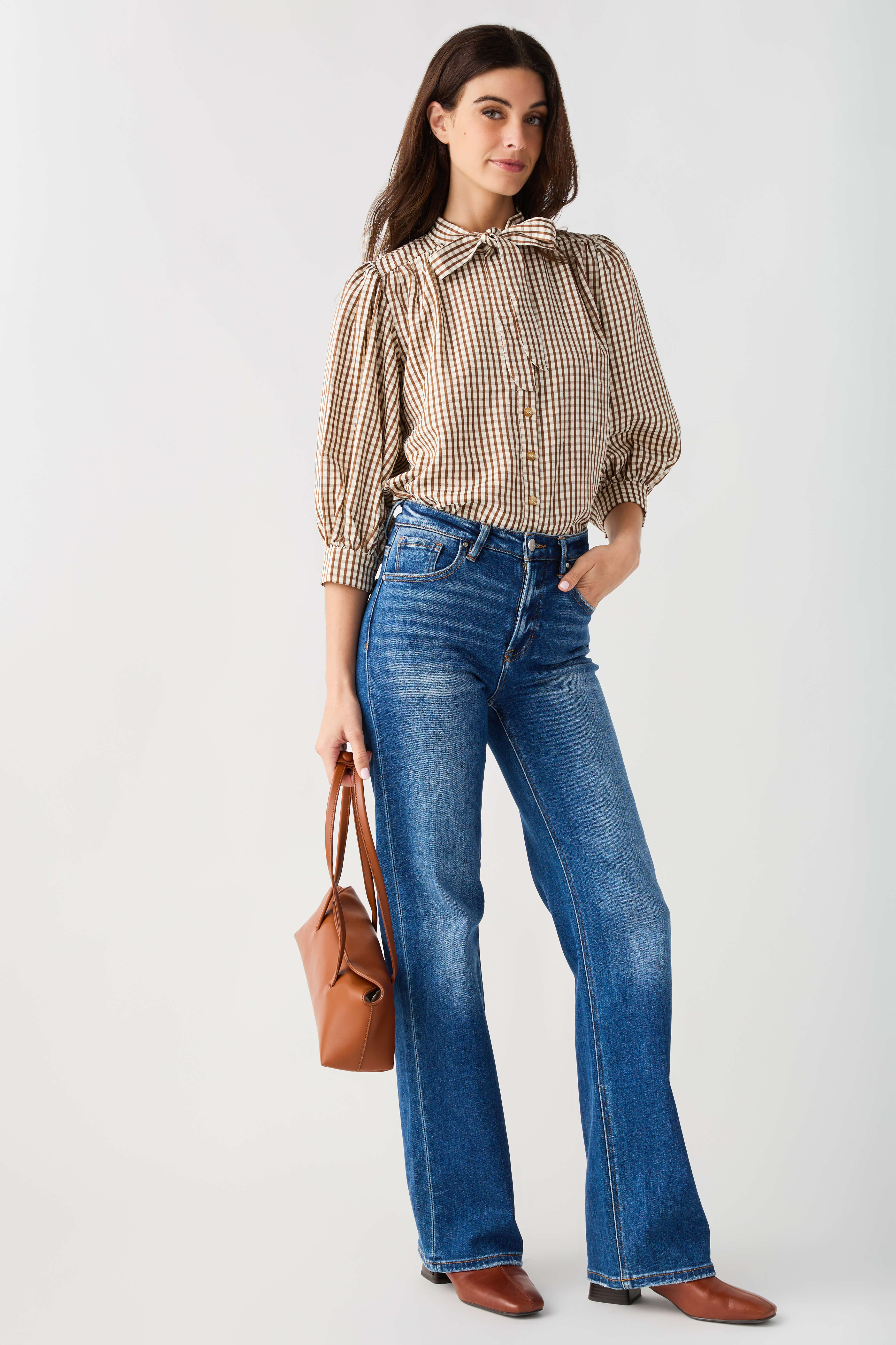 Brown gingham tie-neck blouse with gathered puff sleeves and button front