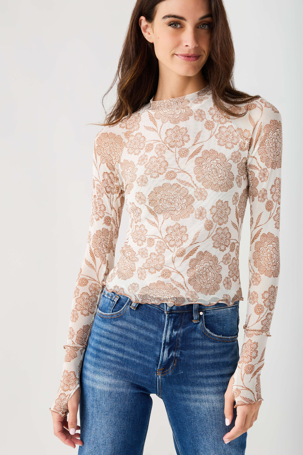 Cream floral mesh mock neck top, long sheer sleeves with lace-like print.