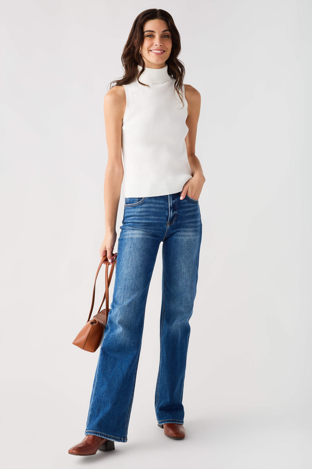 Sleeveless ribbed mock-neck top in off-white, fitted with high neck collar.
