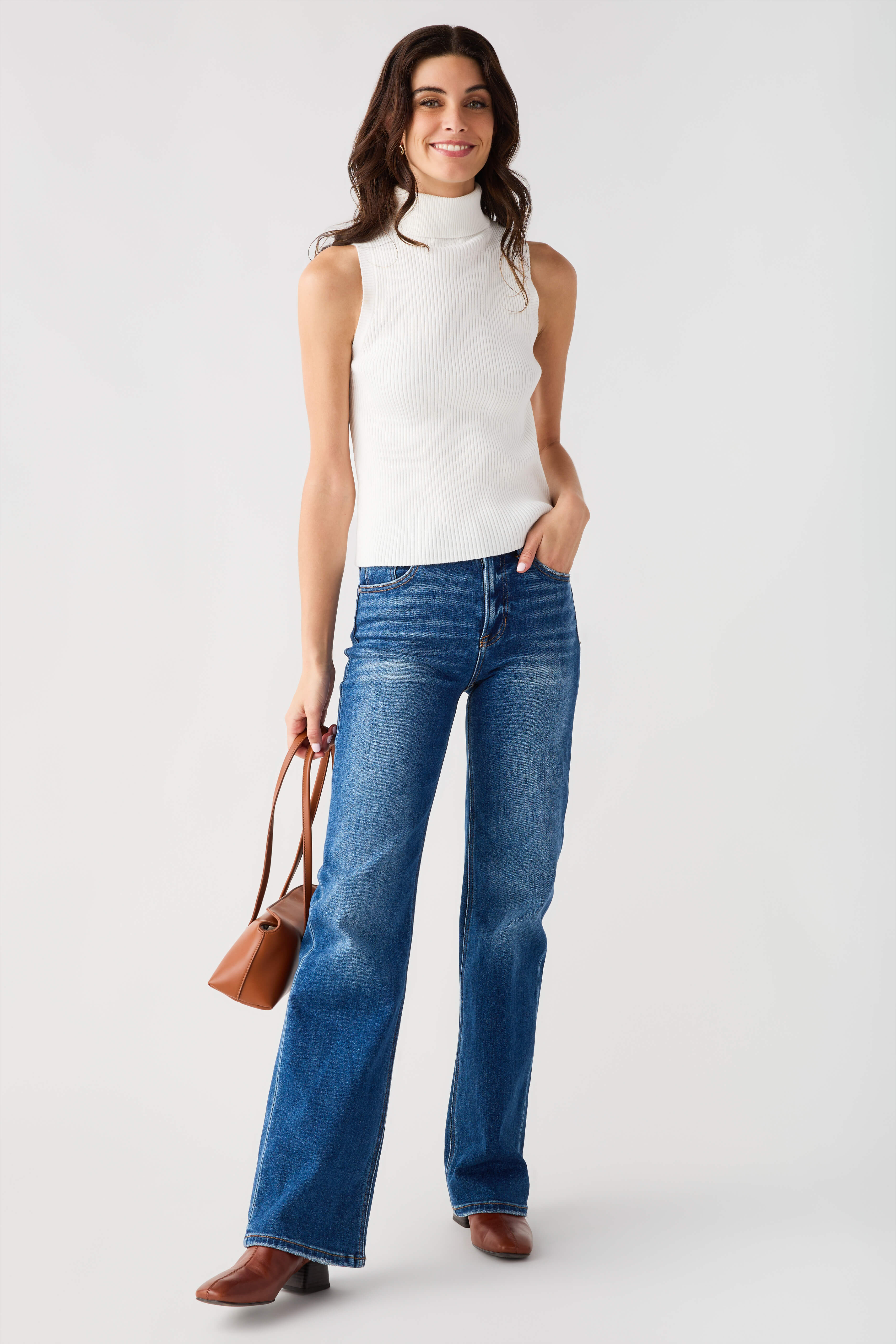 Sleeveless ribbed mock-neck top in off-white, fitted with high neck collar.