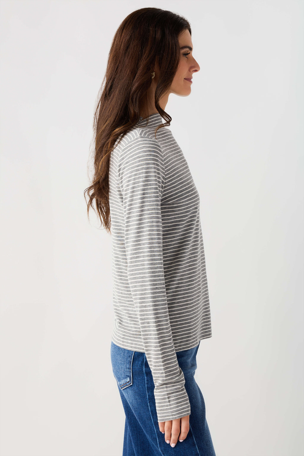 Heather grey-and-white striped mockneck knit top with long sleeves, side profile
