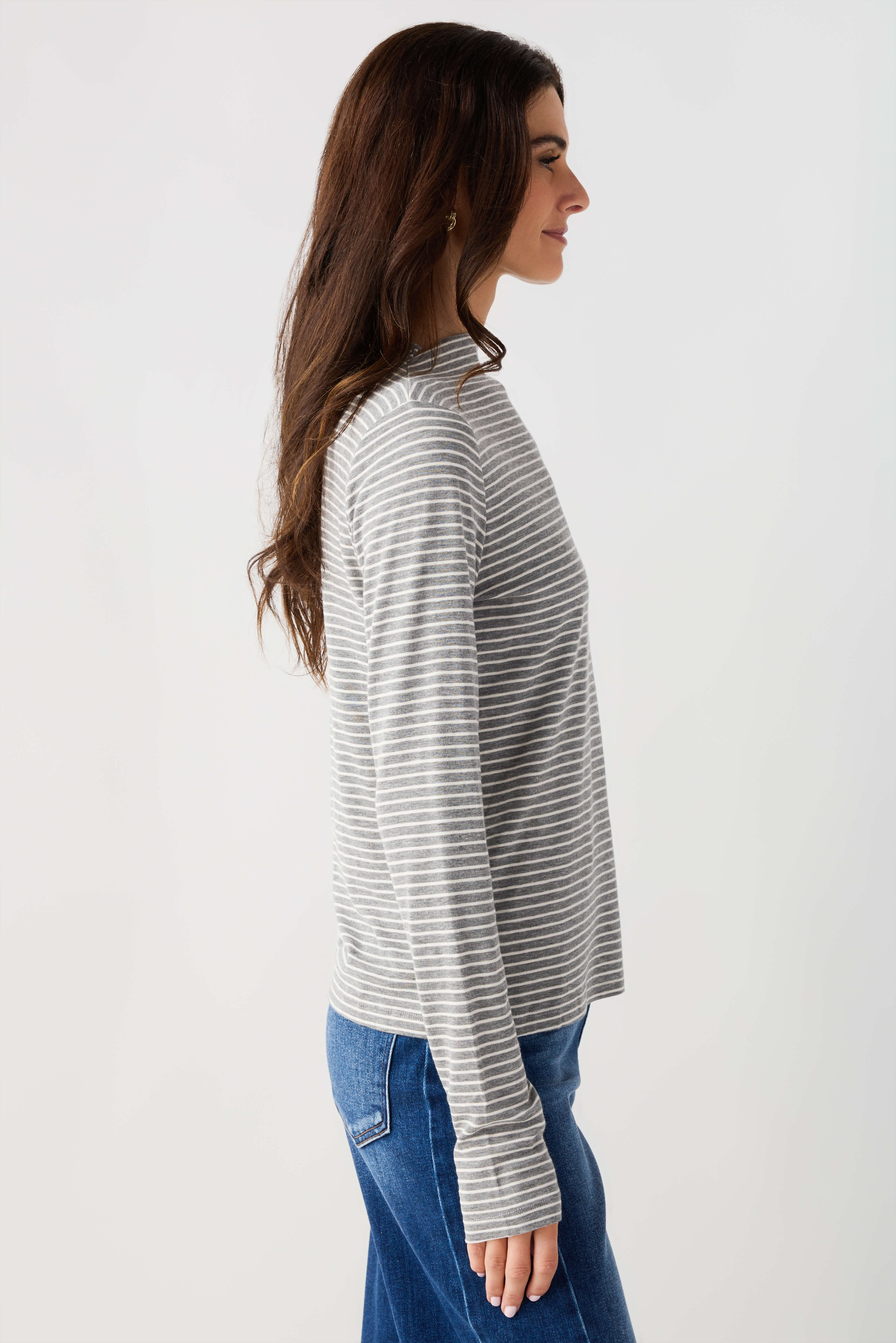 Heather grey-and-white striped mockneck knit top with long sleeves, side profile