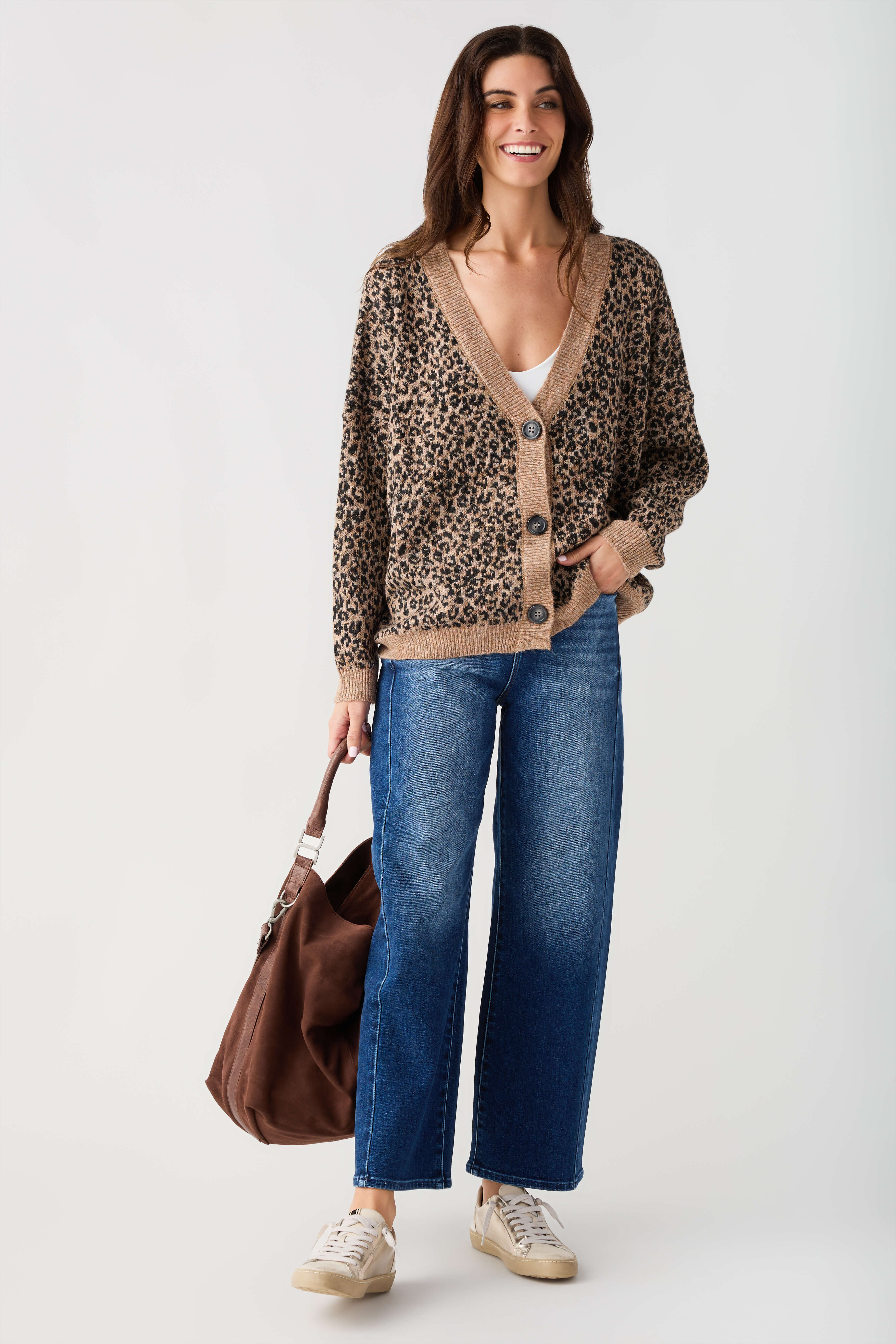 Leopard print cardigan sweater with tan button placket and ribbed trim