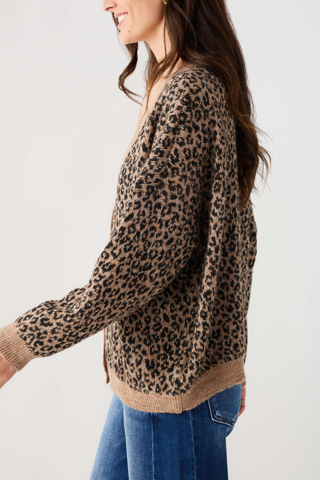 Leopard print cardigan with long sleeves and ribbed tan cuffs and hem