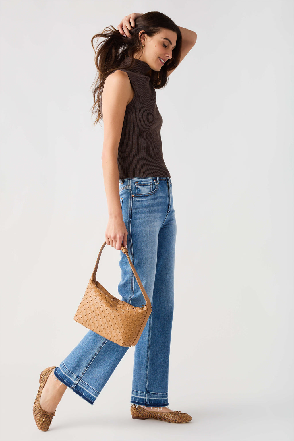 Sleeveless ribbed mock-neck top in dark brown, fitted with high collar.